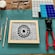 A table set with materials and tools used for creating a mosaic project